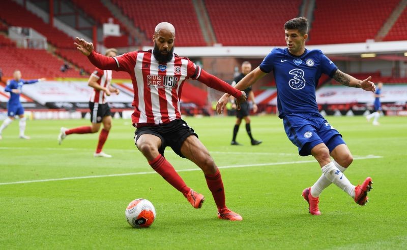 Sheffield United's David McGoldrick in action with Chelsea's Christian Pulisic, as play resumes behind closed doors following the outbreak of the coronavirus disease (COVID-19) Pool via REUTERS/Shaun Botterill
