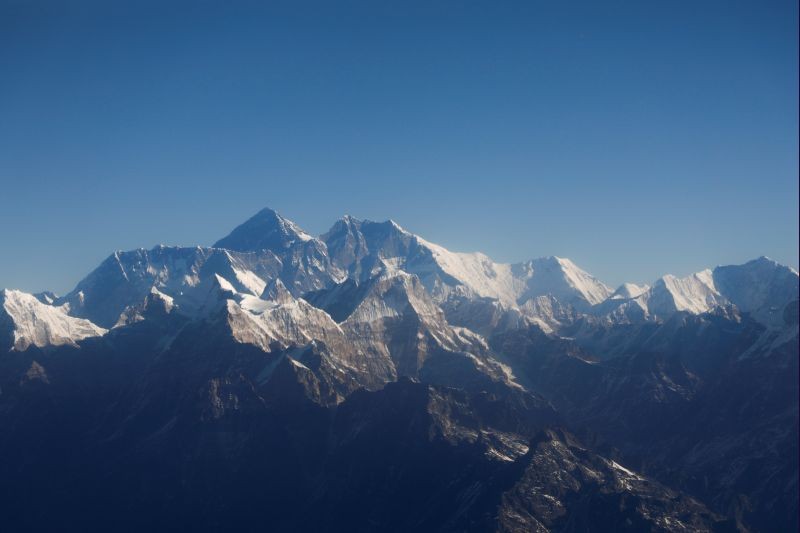 Mount Everest, the world's highest peak, and other peaks of the Himalayan range are seen through an aircraft window during a mountain flight from Kathmandu, Nepal on January 15, 2020. (REUTERS File Photo)