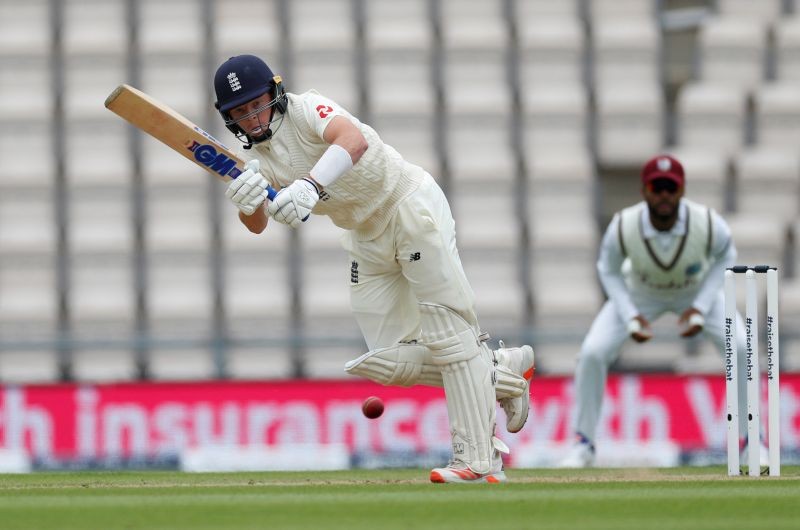 England's Ollie Pope hits a four, as play resumes behind closed doors following the outbreak of the coronavirus disease (COVID-19) Adrian Dennis/Pool via REUTERS