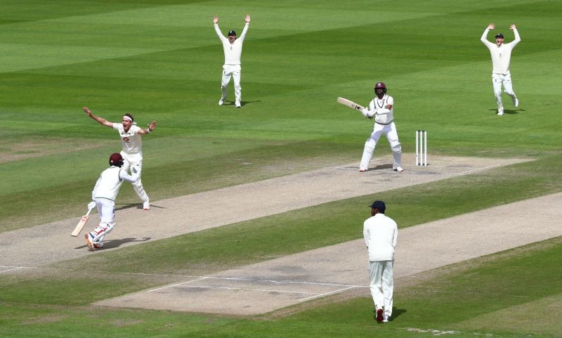 Cricket - Third Test - England v West Indies - Emirates Old Trafford, Manchester, Britain - July 28, 2020 England's Stuart Broad celebrates taking his 500th test wicket with teammates after taking the wicket of West Indies' Kraigg Brathwaite, as play resumes behind closed doors following the outbreak of the coronavirus disease (COVID-19) Michael Steele/Pool via REUTERS
