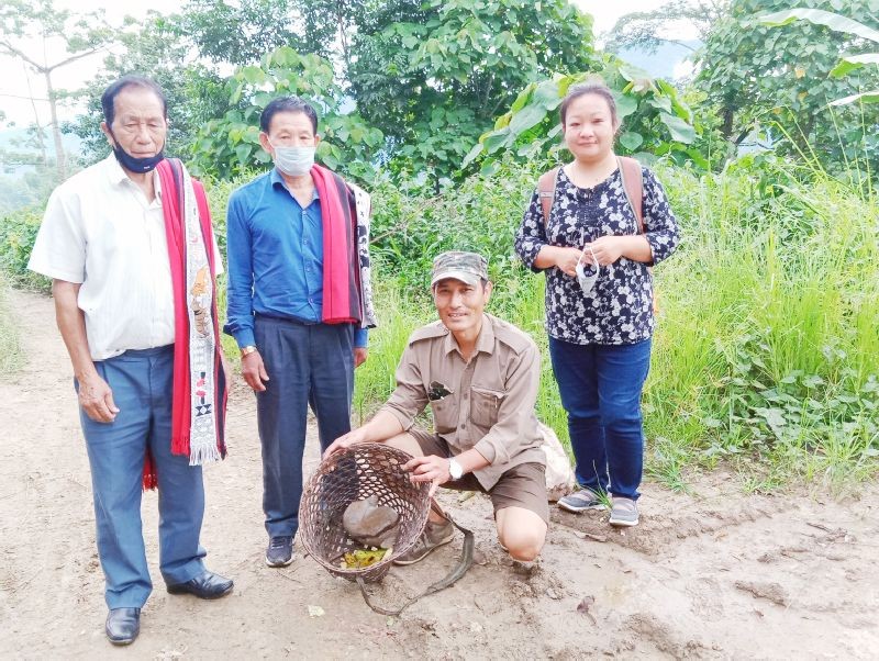 Range Forest Officer, I Sashilemla with village council members and staff before releasing the Slow Loris into Yimlu Forest Reserve.