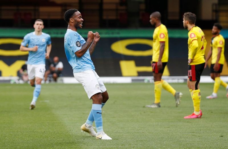 Manchester City's Raheem Sterling celebrates scoring their first goal, as play resumes behind closed doors following the outbreak of the coronavirus disease (COVID-19) Pool via REUTERS/Adrian Dennis