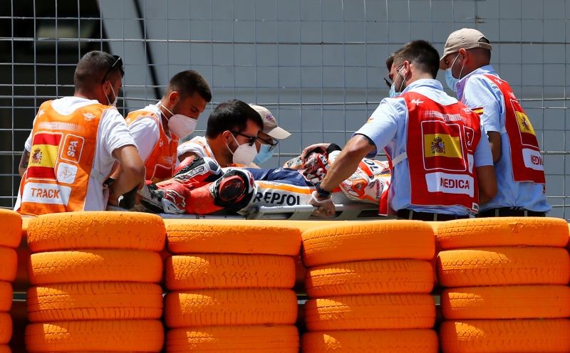 Repsol Honda's Marc Marquez is stretchered into an ambulance after crashing out during the race REUTERS/Marcelo Del Pozo