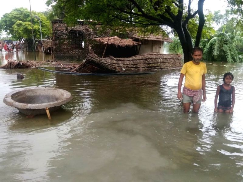 The flood havoc in Bihar is continuously worsening as people in 12 districts are bearing the brunt of floods due to overflow in almost all major rivers and tributaries in the state. (IANS Photo)