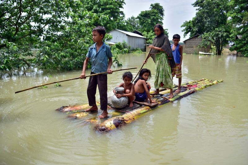 Villagers row a makeshift raft through a flooded field to reach a safer place at the flood-affected Mayong village in Morigaon district, in the northeastern state of Assam on June 29, 2020. (REUTERS File Photo)