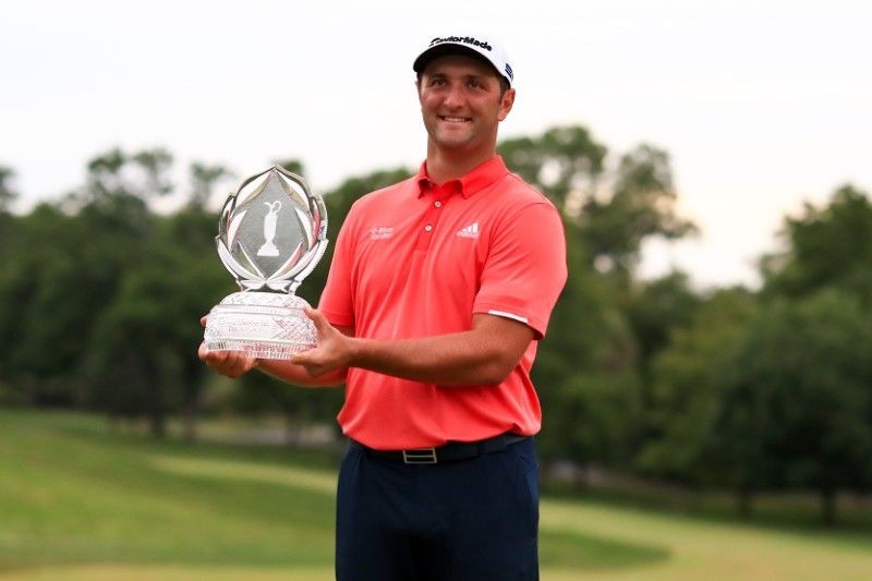 Jon Rahm holds the trophy as he celebrates after winning The Memorial Tournament at Muirfield Village Golf Club. Aaron Doster-USA TODAY Sports