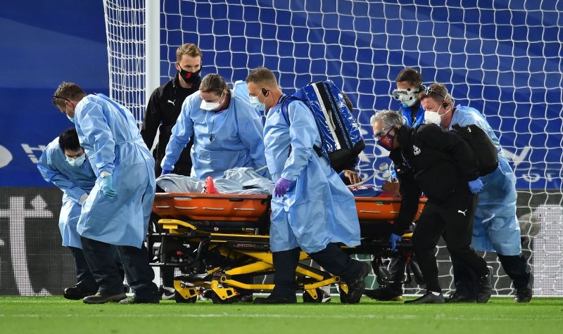 Crystal Palace's Patrick van Aanholt is stretchered off after sustaining an injury, as play resumes behind closed doors following the outbreak of the coronavirus disease (COVID-19) Pool/REUTERS/Glyn Kirk