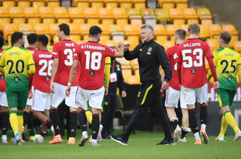 Manchester United manager Ole Gunnar Solskjaer celebrates with Bruno Fernandes after the match, as play resumes behind closed doors following the outbreak of the coronavirus disease (COVID-19) Joe Giddens/Pool via REUTERS/File Photo