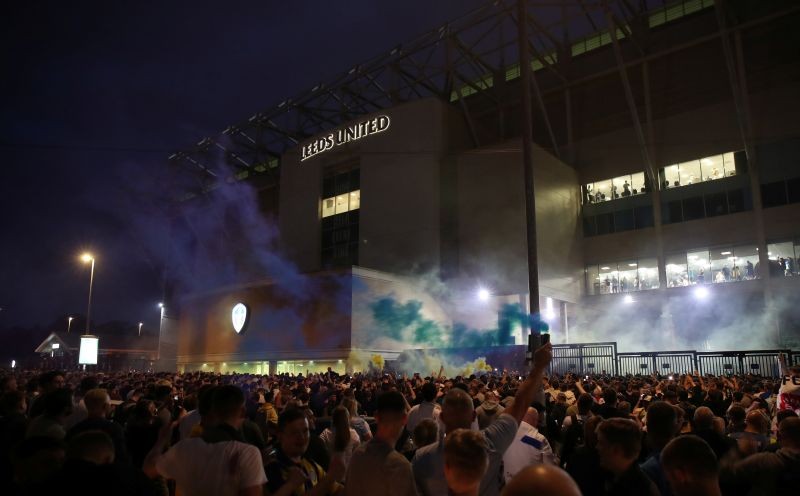 Leeds United fans celebrate promotion to the Premier League outside Elland Road REUTERS/Molly Darlington