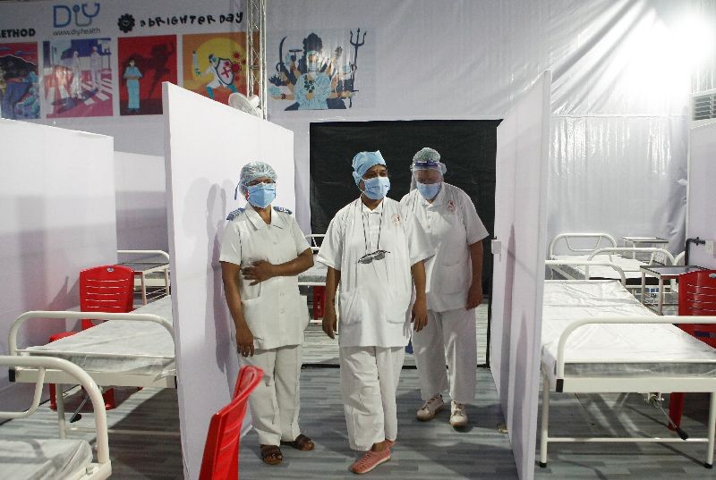 Nurses wearing protective masks stand inside a temporary facility created to facilitate cancer patients diagnosed with coronavirus disease (COVID-19) in Mumbai, India, July 30, 2020. REUTERS/Francis Mascarenhas