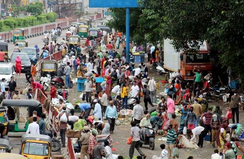 People defy social distancing norms in a market in Surat. Pic: ANI