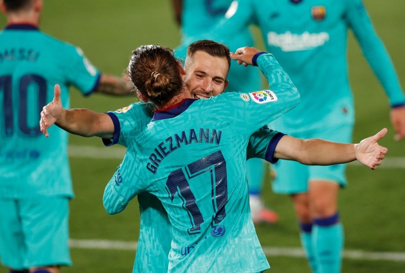 Barcelona's Antoine Griezmann celebrates scoring their third goal with Sergi Roberto, as play resumes behind closed doors following the outbreak of the coronavirus disease (COVID-19) REUTERS/Albert Gea