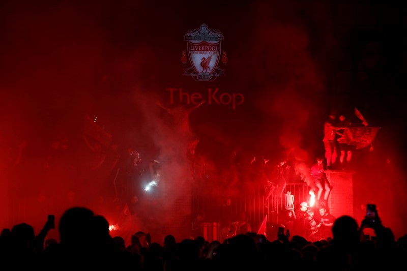 Liverpool fans celebrate with flares outside the stadium after the match Action Images via Reuters/Matthew Childs