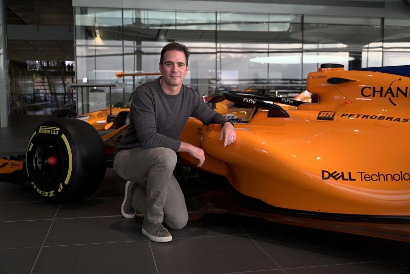 Nascar driver Jimmie Johnson poses for a photograph with an F1 car at the McLaren Technology Centre in Woking, Britain November 21, 2018. REUTERS/Will Russell/Files