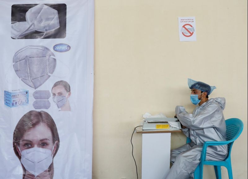 A man wears a protective face mask as he works at a mask factory, during the coronavirus disease (COVID-19) outbreak in Kabul, Afghanistan on July 2, 2020. (REUTERS File Photo)