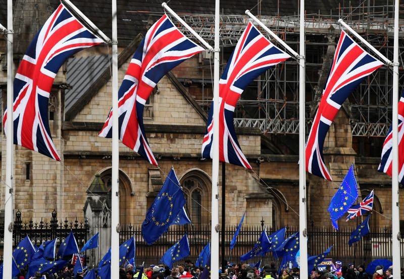 British Union Jack and EU flags are seen during a protest outside the Houses of Parliament in London, Britain on January 30, 2020. (REUTERS File Photo)