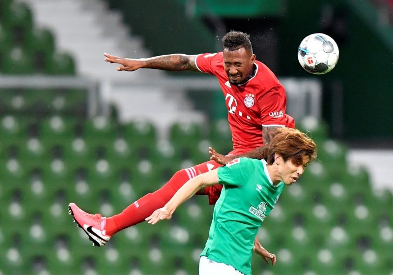 Bayern Munich's Jerome Boateng in action with Werder Bremen's Yuya Osako, following the resumption of play behind closed doors after the outbreak of the coronavirus disease (COVID-19) Martin Meissner/Pool via REUTERS