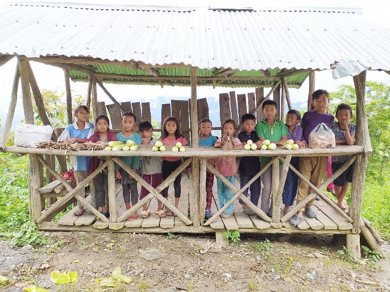 A group of children in Vongva village under Kiphire District sells corn and other items to add up to their family income. (Photo Courtesy: Zitsanglen Robert)
