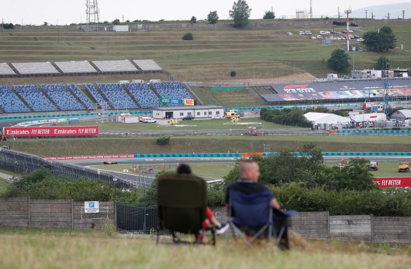 Fans watch the qualifying from a hill following the resumption of F1 after the outbreak of the coronavirus disease (COVID-19) in Mogyorod, Hungary, July 18, 2020. REUTERS/Bernadett Szabo