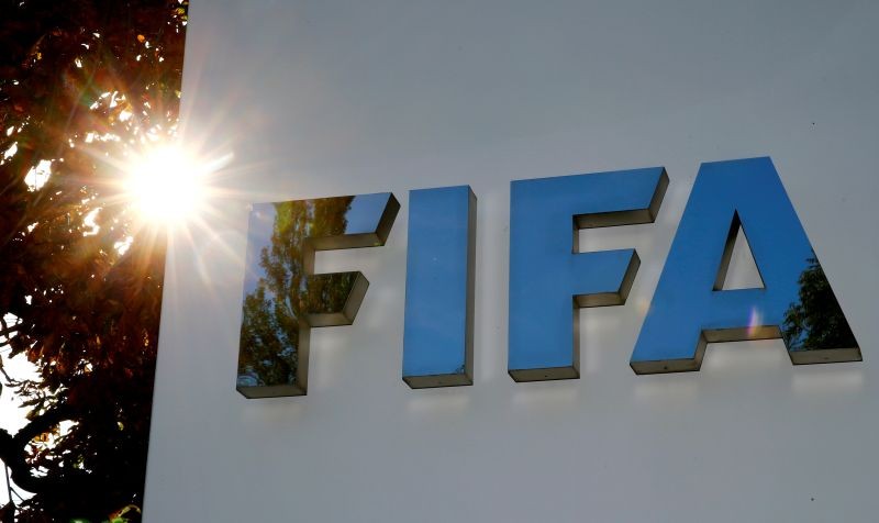 FILE PHOTO: The logo of FIFA is seen in front of its headquarters in Zurich, Switzerland September 26, 2017. REUTERS/Arnd Wiegmann/File Photo