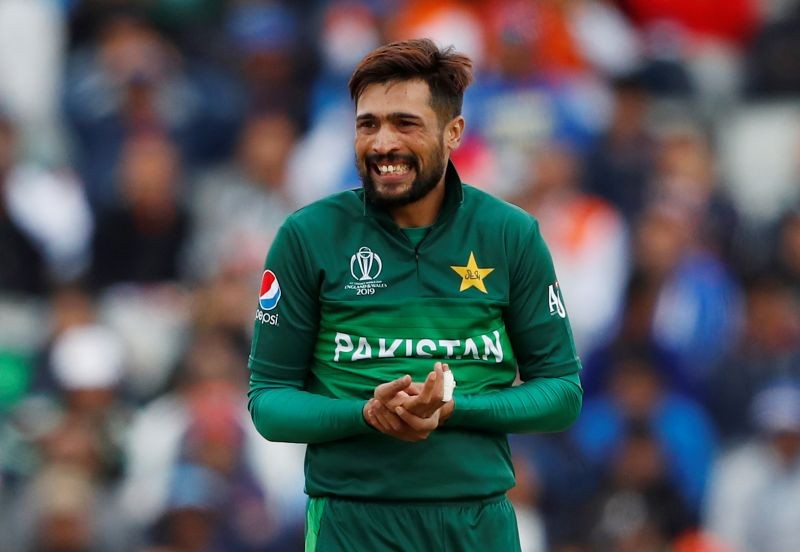 FILE PHOTO: Cricket - ICC Cricket World Cup - India v Pakistan - Emirates Old Trafford, Manchester, Britain - June 16, 2019 Pakistan's Mohammad Amir holds his hand after attempting a catch Action Images via Reuters/Andrew Boyers