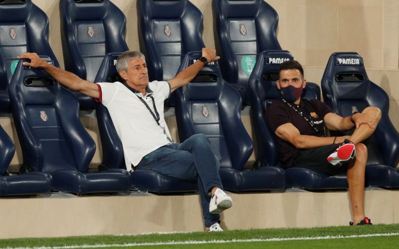Barcelona coach Quique Setien and assistant coach Eder Sarabia before the match, as play resumes behind closed doors following the outbreak of the coronavirus disease (COVID-19) REUTERS/Albert Gea