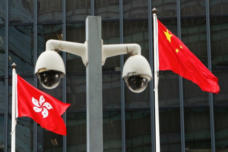 Hong Kong and Chinese national flags are flown behind a pair of surveillance cameras outside the Central Government Offices in Hong Kong, China July 20, 2020. (REUTERS File Photo)