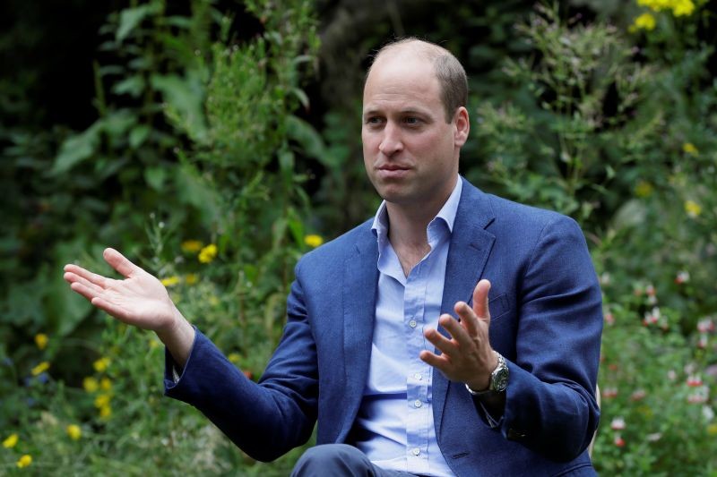 FILE PHOTO: Britain's Prince William, Duke of Cambridge, speaks during a visit to the Garden House, part of the Light Project, which works on getting people safely off the streets throughout the coronavirus disease (COVID-19) outbreak, in Peterborough, Britain, July 16, 2020. Kirsty Wigglesworth/Pool via REUTERS