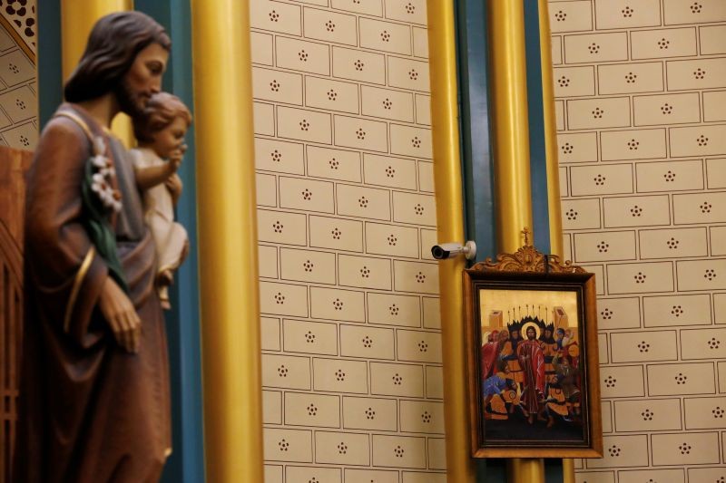 A surveillance camera is seen near a religious painting during a mass at Xishiku Cathedral, a government-sanctioned Catholic church, on Christmas Eve in Beijing, China on December 24, 2019. (REUTERS File Photo)