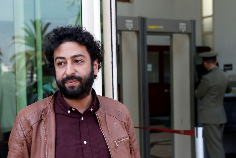 Journalist and activist Omar Radi waits outside court in Casablanca, Morocco on March 12, 2020. (REUTERS File Photo)