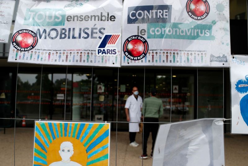 Signs that read "All together against Coronavirus" are seen at the main entrance of the Robert Ballanger hospital in Aulnay-sous-Bois near Paris during the outbreak of the coronavirus disease (COVID-19) in France. Seine-Saint-Denis, a mainly working class and multiracial suburb, was already lacking doctors and resources before the coronavirus crisis and has seen a bigger spike in mortality than neighbouring Paris. (REUTERS File Photo)