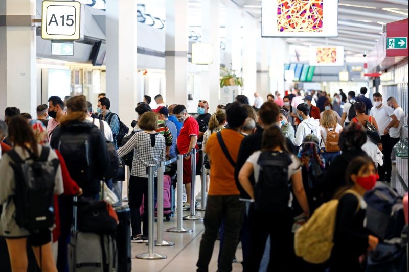 Travellers are seen at the Tegel airport, as the spread of the coronavirus disease (COVID-19) continues, in Berlin, Germany on July 29. (REUTERS Photo)