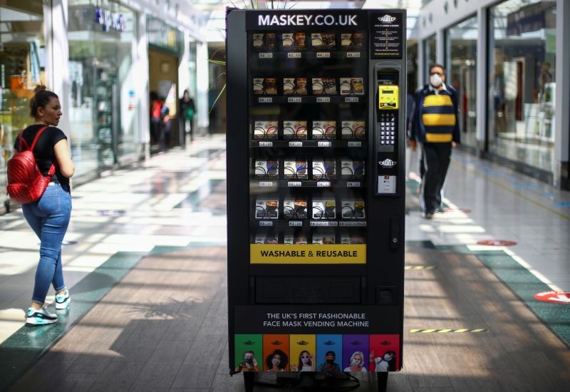 A vending machine that sells protective masks is seen in a shopping centre, following the coronavirus disease (COVID-19) outbreak, in Ilford, London, Britain on July 29, 2020. (REUTERS Photo)