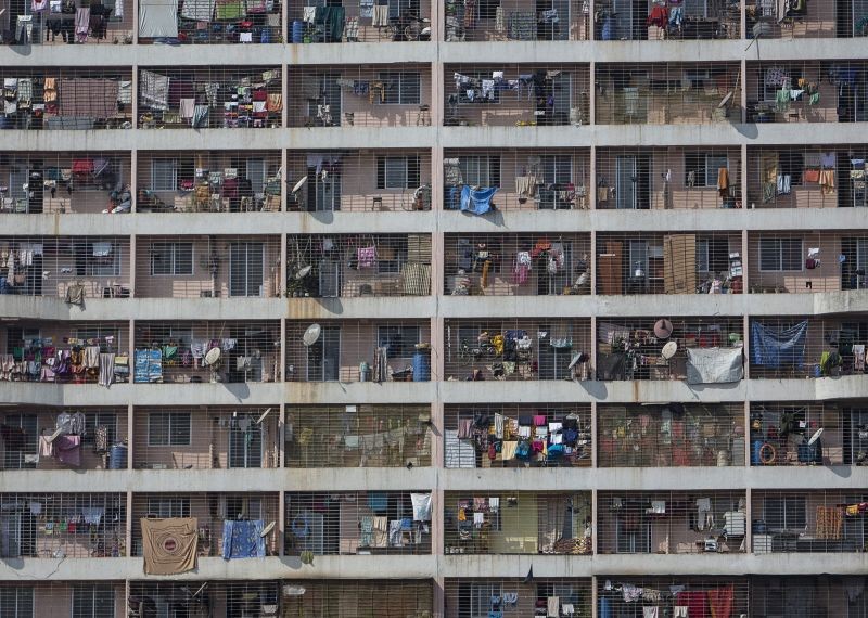 Windows of various apartments of a high-rise residential building are seen in the western suburb of Mumbai on February 8, 2014. (REUTERS/ File Photo)