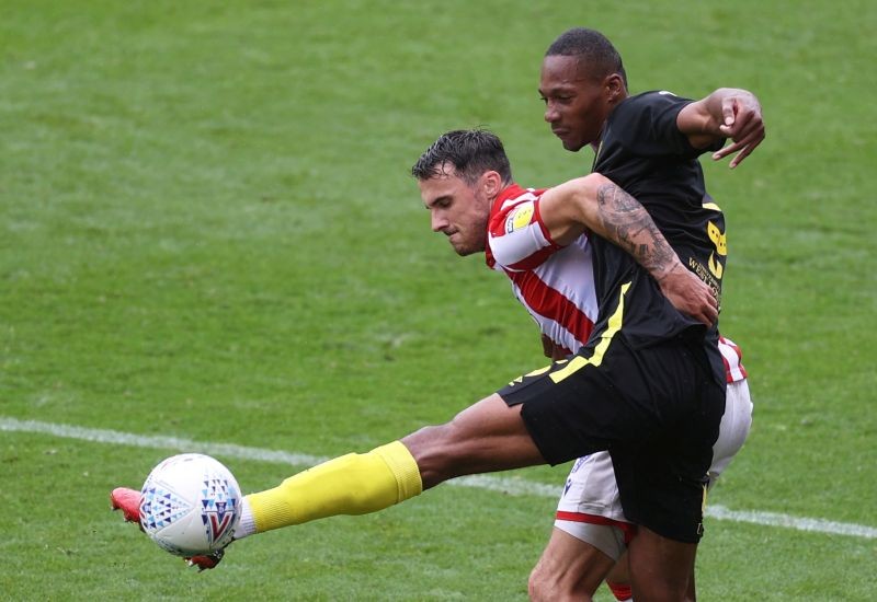 Stoke City's Lee Gregory in action with Brentford's Ethan Pinnock, as play resumes behind closed doors following the outbreak of the coronavirus disease (COVID-19) Action Images/Carl Recine