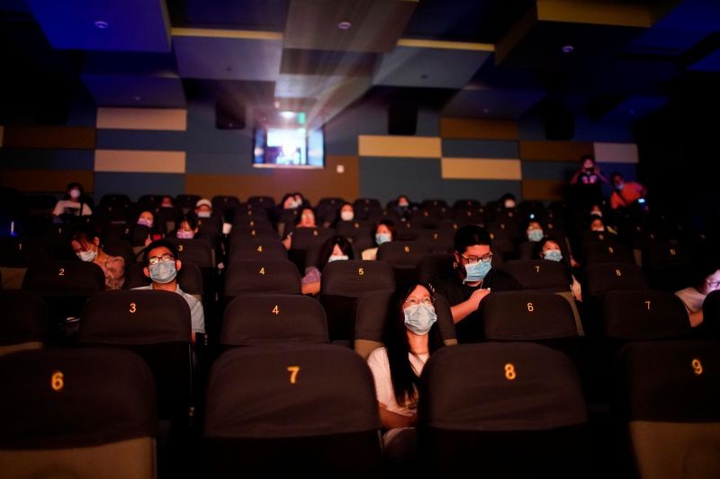People wearing face masks watch a movie in a cinema as it reopens following the coronavirus disease (COVID-19) outbreak, in Shanghai, China on July 20. (REUTERS Photo)