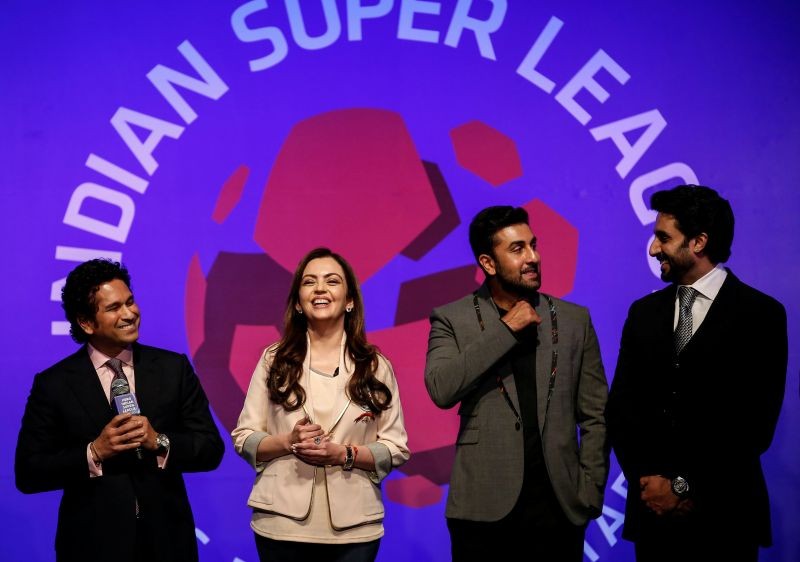 FILE PHOTO: Bollywood actors and co-owners of football clubs, Abhishek Bachhan (R) and Ranbir Kapoor (2nd R), and Nita Ambani, businesswoman and promoter of the Indian Super League, react as retired cricketer and co-owner of the Kerala Blasters Sachin Tendulkar (L) speaks during the emblem-unveiling ceremony of Indian Super League in Mumbai August 28, 2014. REUTERS/Danish Siddiqui/File Photo