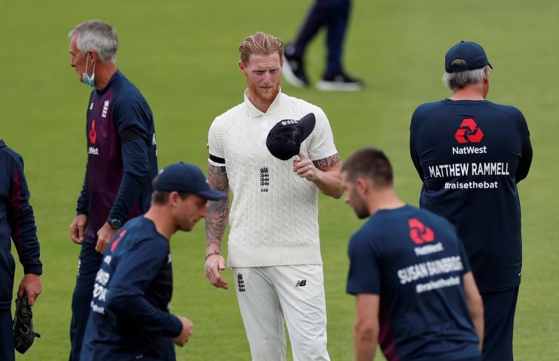 England's Ben Stokes with teammates before the start of play, as play resumes behind closed doors following the outbreak of the coronavirus disease (COVID-19) Adrian Dennis/Pool via REUTERS