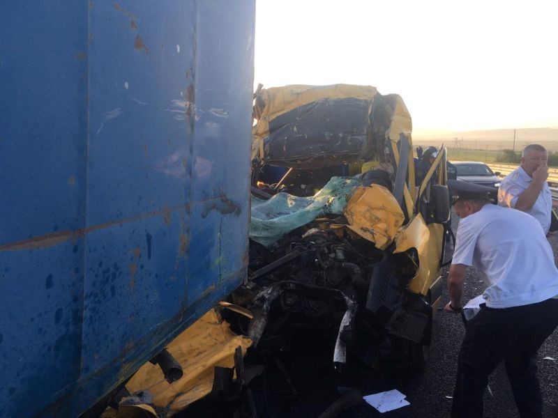 Members of Russian Emergencies Ministry and police officers inspect a minibus that crashed into a truck near the town of Belogorsk, Crimea on July 31, 2020. (REUTERS Photo)