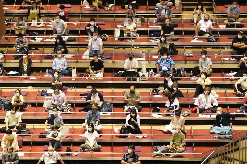 Spectators wearing protective masks practice social distancing as they watch the July Grand Sumo Tournament, amid the coronavirus disease (COVID-19) outbreak, at Ryogoku Kokugikan in Tokyo, Japan July 19, 2020, in this photo taken by Kyodo. Mandatory credit Kyodo/via REUTERS