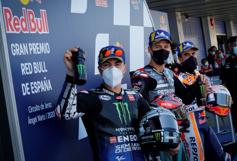 MotoGP - Spanish Grand Prix - Circuito de Jerez, Jerez, Spain - July 18, 2020 Petronas Yamaha SRT's Fabio Quartararo poses after taking pole position with second position Monster Energy Yamaha MotoGP's Maverick Vinales and third position Repsol Honda's Marc Marquez motogp.com/Handout via REUTERS