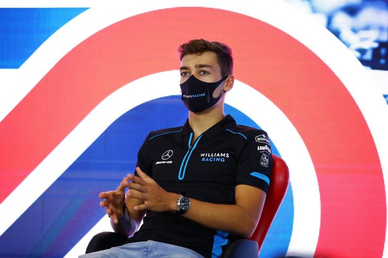 Formula One F1 - British Grand Prix - Silverstone Circuit, Silverstone, Britain - July 30, 2020 Williams' George Russell wears a face mask during a press conference ahead of the British Grand Prix FIA/Handout via REUTERS