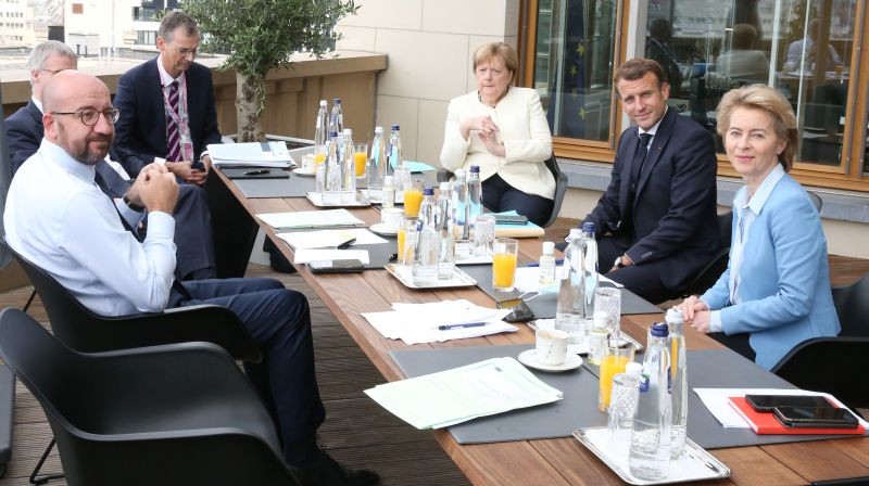 President of the European Council Charles Michel (L), Germany's Chancellor Angela Merkel (C), France's President Emmanuel Macron (2nd R) and President of the European Commission Ursula von der Leyen pose during a meeting at the first face-to-face EU summit since the coronavirus disease (COVID-19) outbreak, in Brussels, Belgium on July 19, 2020. (REUTERS Photo)