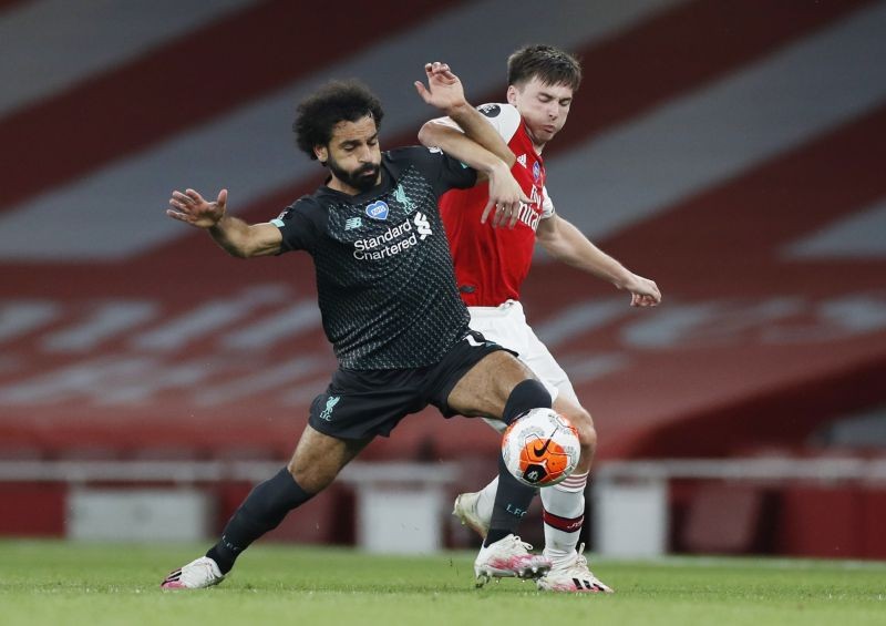 Liverpool's Mohamed Salah in action with Arsenal's Kieran Tierney, as play resumes behind closed doors following the outbreak of the coronavirus disease (COVID-19) REUTERS PHOTO