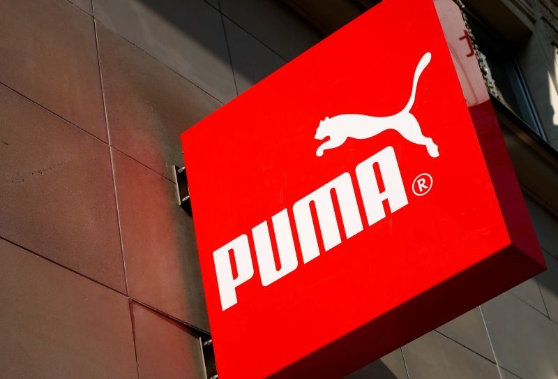 FILE PHOTO: The logo of German sports goods firm Puma is seen at the entrance of one of its stores in Vienna, Austria, March 18, 2016. REUTERS/Leonhard Foeger/File Photo