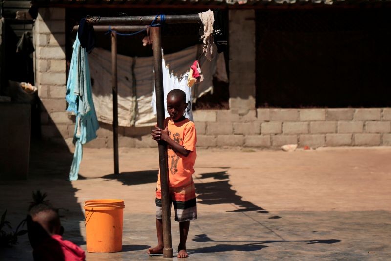 Densel Pamire plays outside his family's home during a nationwide lockdown to help curb the coronavirus disease (COVID-19) spread in Harare, Zimbabwe on May 9, 2020. (REUTERS File Photo)