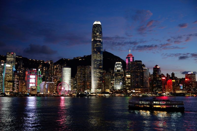 A Star Ferry boat crosses Victoria Harbour in front of a skyline of buildings during sunset, as a meeting on national security legislation takes place in Hong Kong, China on June 29, 2020. (REUTERS File Photo)