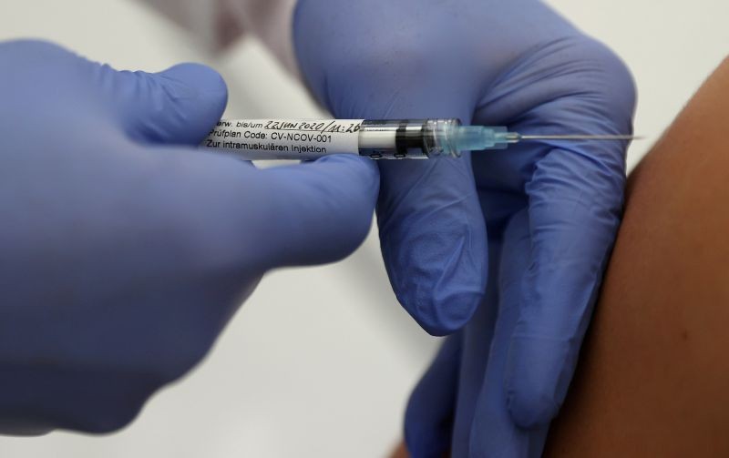 Professor Gottfried Kremsner injects a vaccination against the coronavirus disease (COVID-19) from German biotechnology company CureVac to a volunteer at the start of a clinical test series at his tropical institute of the university clinic in Tuebingen, Germany on June 22, 2020. (REUTERS File Photo)
