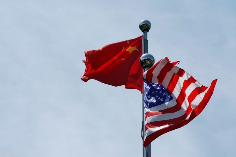 Chinese and U.S. flags flutter near The Bund in Shanghai, China on July 30, 2019. (REUTERS File Photo)