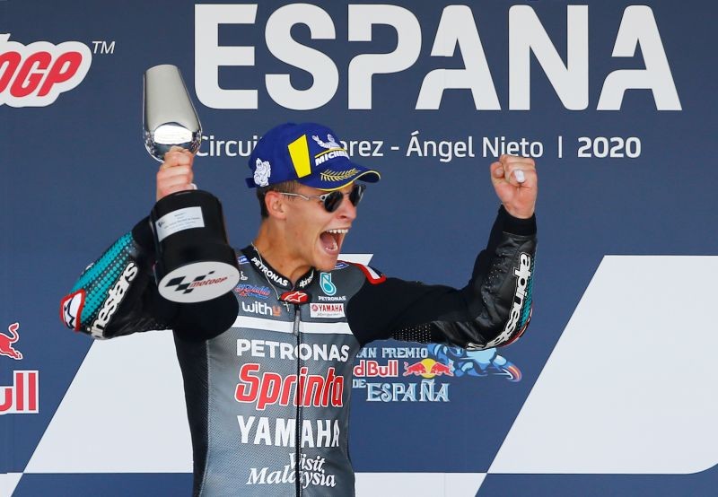 MotoGP - Spanish Grand Prix - Circuito de Jerez, Jerez, Spain - July 19, 2020 Petronas Yamaha SRT's Fabio Quartararo celebrates winning the race on the podium with the trophy REUTERS/Marcelo Del Pozo